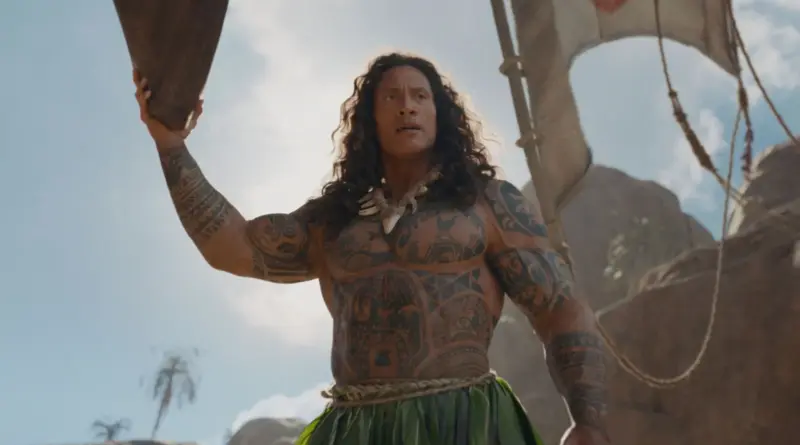 Dwayne Johnson Caracterizado Como El Personaje De Maui En Vaiana Sosteniendo Un Gran Objeto De Madera.
