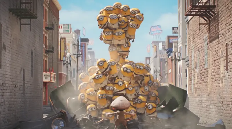 Una pila vertical gigante de decenas de Minions formando una torre humana en medio de una calle de la ciudad en Minions & Monsters.
